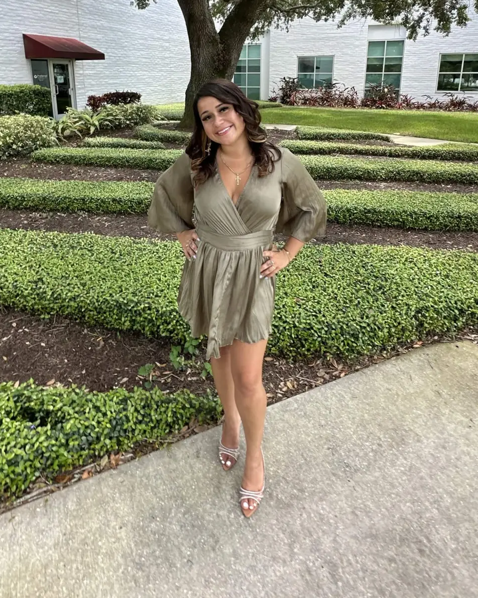 Brandi, licensed insurance agent, standing outside her office in Tampa